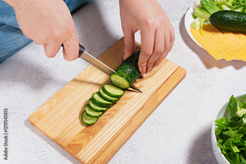 Preparing Fresh Salad with Cucumber