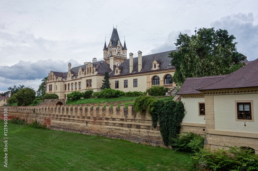 Fototapeta premium Schloss Grafenegg castle with its clock tower in Austria with moat