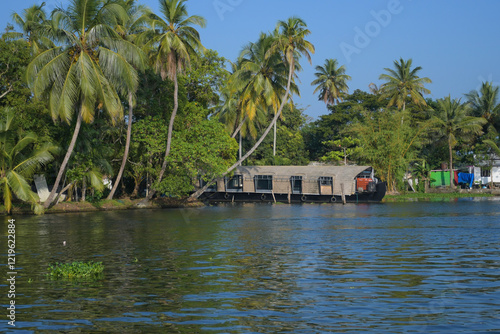 Houseboat in Kerala backwater sailing through the canals in Alleppey