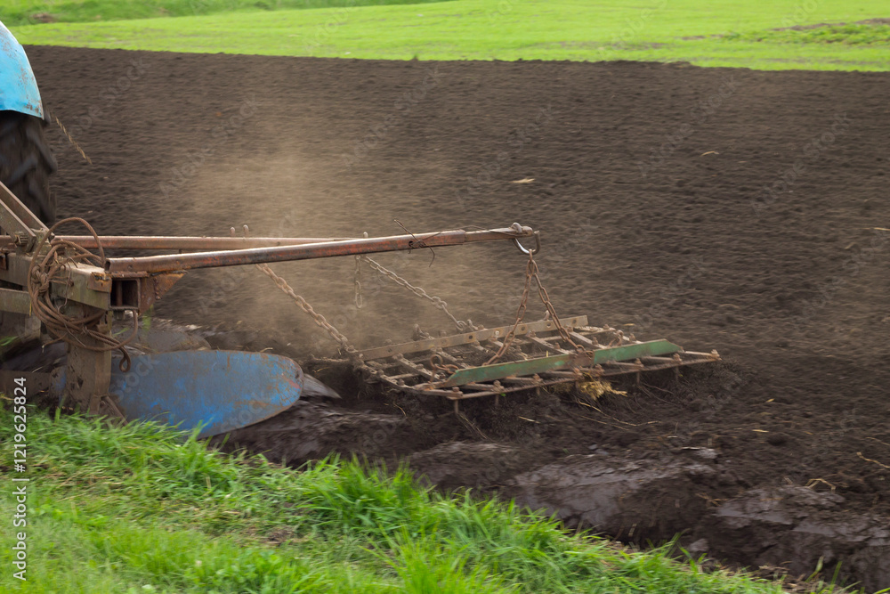 Fototapeta premium tractor working in the field