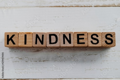 The word kindness spelled out with wooden letter blocks. photo