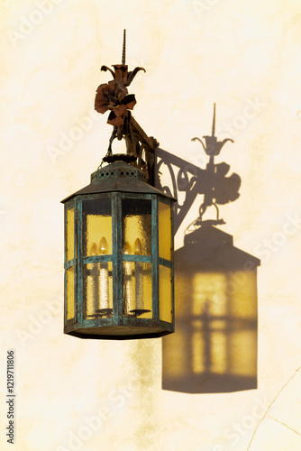Ancient lamp at the castle gate with beautiful metal decoration, minimalism