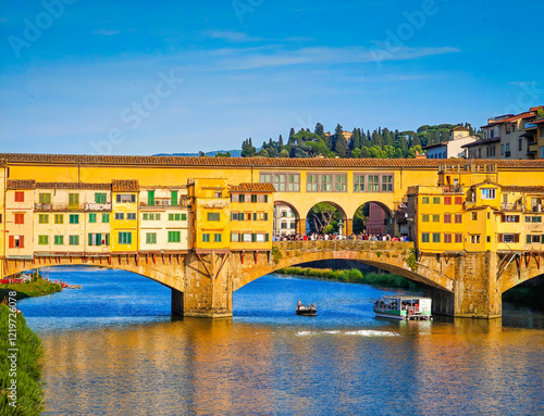 Ponte Vecchio bridge over Arno River in Florence. Picturesque medieval arched river bridge with Roman origins, lined with jewelry and souvenir shops.