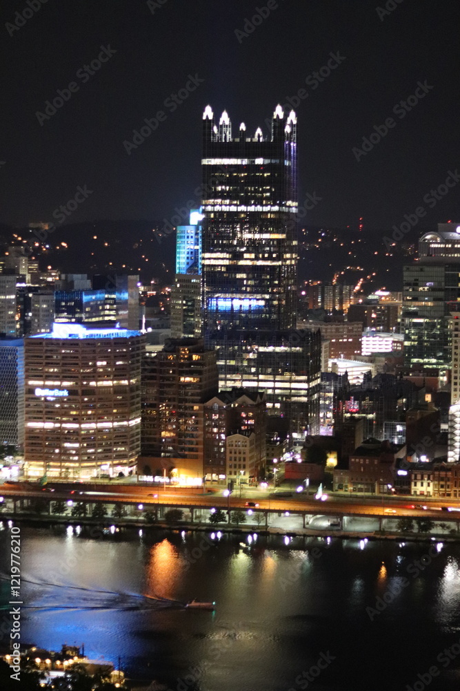Fototapeta premium Birds eye view of the city skyline of downtown Pittsburgh, Pennsylvania at night.