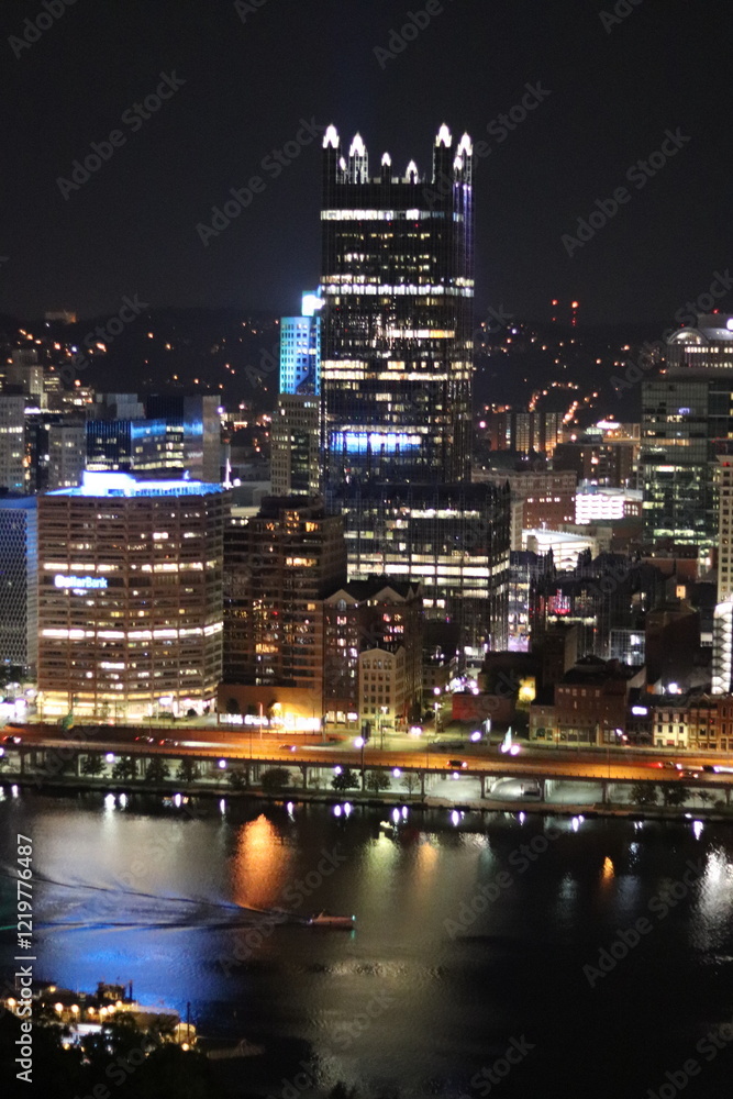 Fototapeta premium Birds eye view of the city skyline of downtown Pittsburgh, Pennsylvania at night.