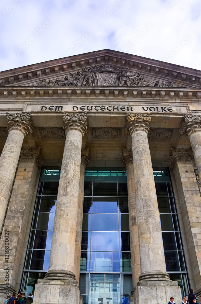 Fototapeta premium Reichstag building facade with inscription Dem Deutschen Volke showing neoclassical columns