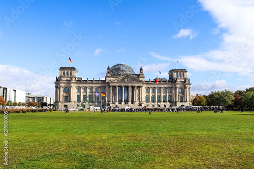 Sticker Reichstag building with german flags waving in Berlin, Germany