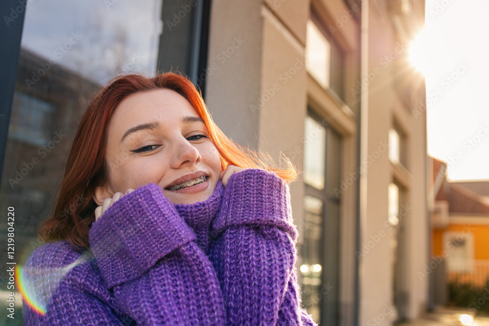 Smiling Redhead Girl with Braces Wearing a Purple Knitted Sweater Smiling Redhead Girl with Braces Wearing a Purple Knitted Sweater