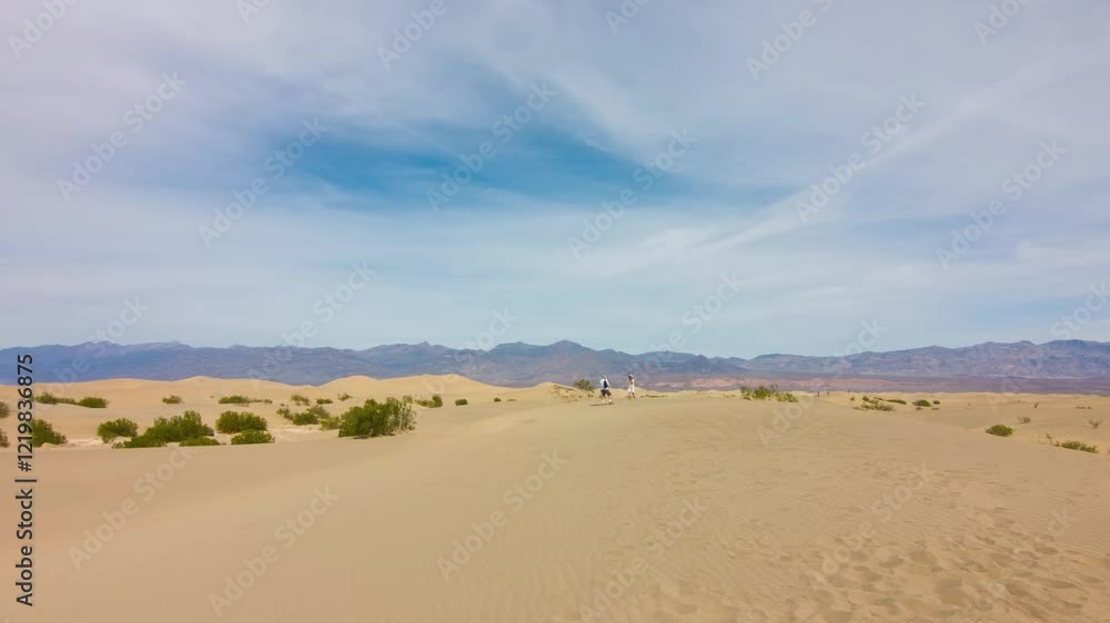 Capture the amazing view of rolling sand dunes in Death Valley, California, showcasing the incredible beauty of this unique desert environment. Capture the amazing view of rolling sand dunes in Death Valley, California, showcasing the incredible beauty of this unique desert environment.