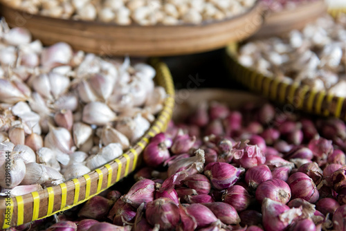 Trays of garlic and shallots photo