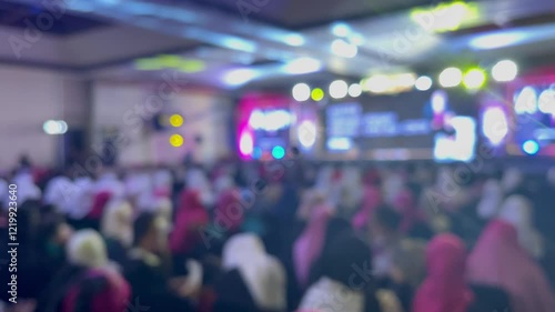Wallpaper Mural the blur of a large crowd of people attending an event, the colors of their clothing and the lights create a visually intriguing image. The abstract background is intentionall Torontodigital.ca