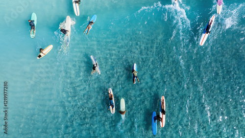Drone Aerial View of Surfers Riding Waves in Hawaii Sea with Surfboards in the Blue transparent Ocean 