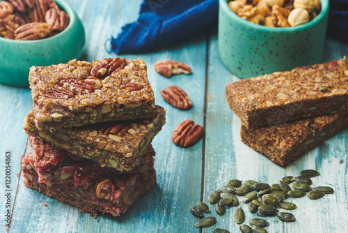 Energy Bars and Mix nuts on a Blue Color Wooden Table