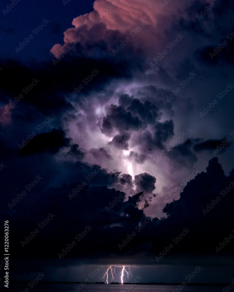 Fototapeta premium Lightning through clouds