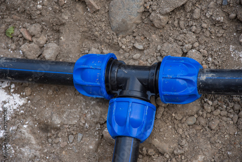 New water installations with faucets and black PVC pipes in Bistrita, Romania, August 2022 photo