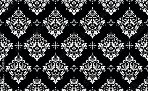 Wallpaper in the style of Baroque. Seamless vector background. White and black floral ornament. Graphic pattern for fabric, wallpaper, packaging. Ornate Damask flower ornament.