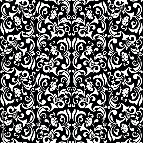 Wallpaper in the style of Baroque. Seamless vector background. White and black floral ornament. Graphic pattern for fabric, wallpaper, packaging. Ornate Damask flower ornament.