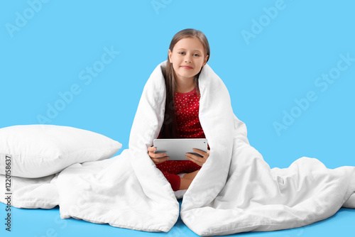 Little girl with blanket an...
