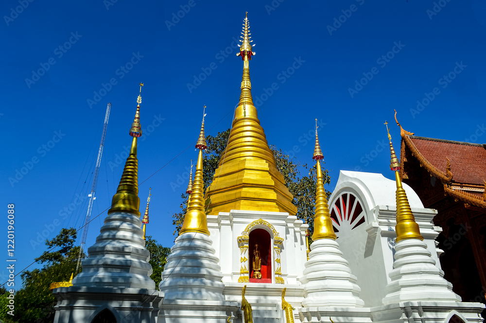 Naklejka premium Chapel and Golden Pagoda, Lanna Architecture, Symbols of Buddhism, South East Asia at Doi Sapphanyu Temple, Mae Wang Chiangmai, Northern Thailand