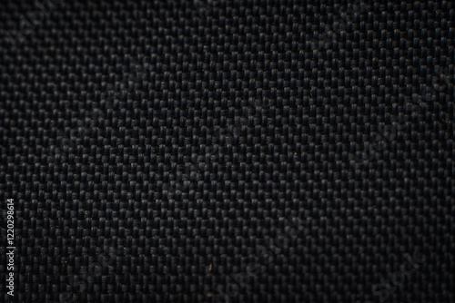 Textured black fabric showcasing intricate weaving details for stylish applications