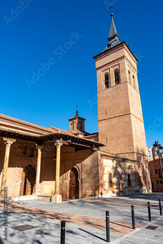 High bell tower of the co-cathedral of Guadalajara in Mudejar architectural style, Guadalajara Spain. photo