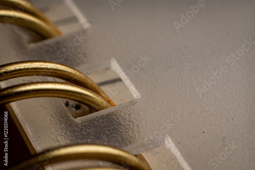 Detailed view of a binder with metallic rings showcasing organization tools for education and business tasks