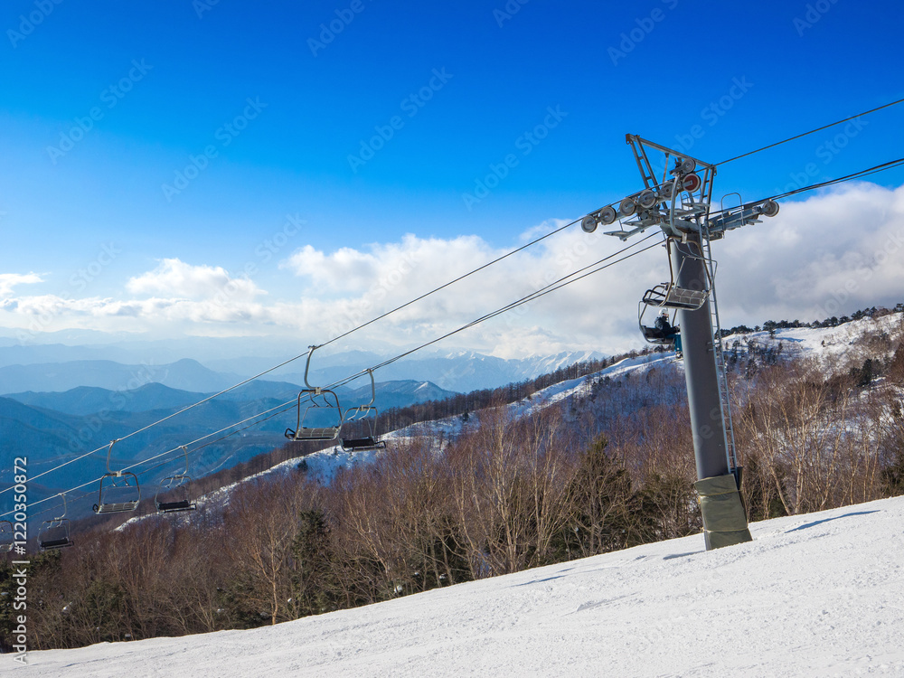 Ski slope with chairlifts on a sunny day (Kawaba, Gunma, Japan) Ski slope with chairlifts on a sunny day (Kawaba, Gunma, Japan)