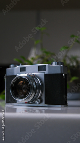 A vintage film camera is waiting for you on the table. When will you start taking pictures