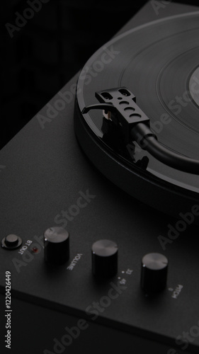 A vinyl record spinning on a turntable, creating music for the atmosphere