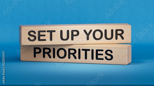 Wooden man shows with a hand to white board with text Set up your priorities. Wooden cube blocks. Copy space.3D rendering on blue background.