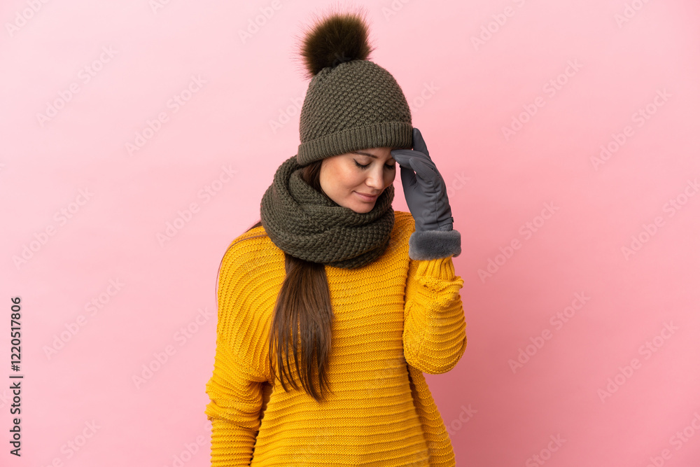 Young caucasian girl with winter hat isolated on pink background laughing Young caucasian girl with winter hat isolated on pink background laughing