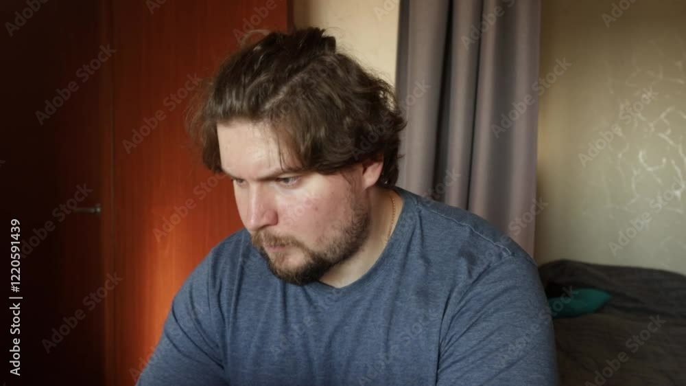 Angry man working on laptop, intense reaction to business tasks, stress during remote work. Angry man working on laptop, intense reaction to business tasks, stress during remote work.