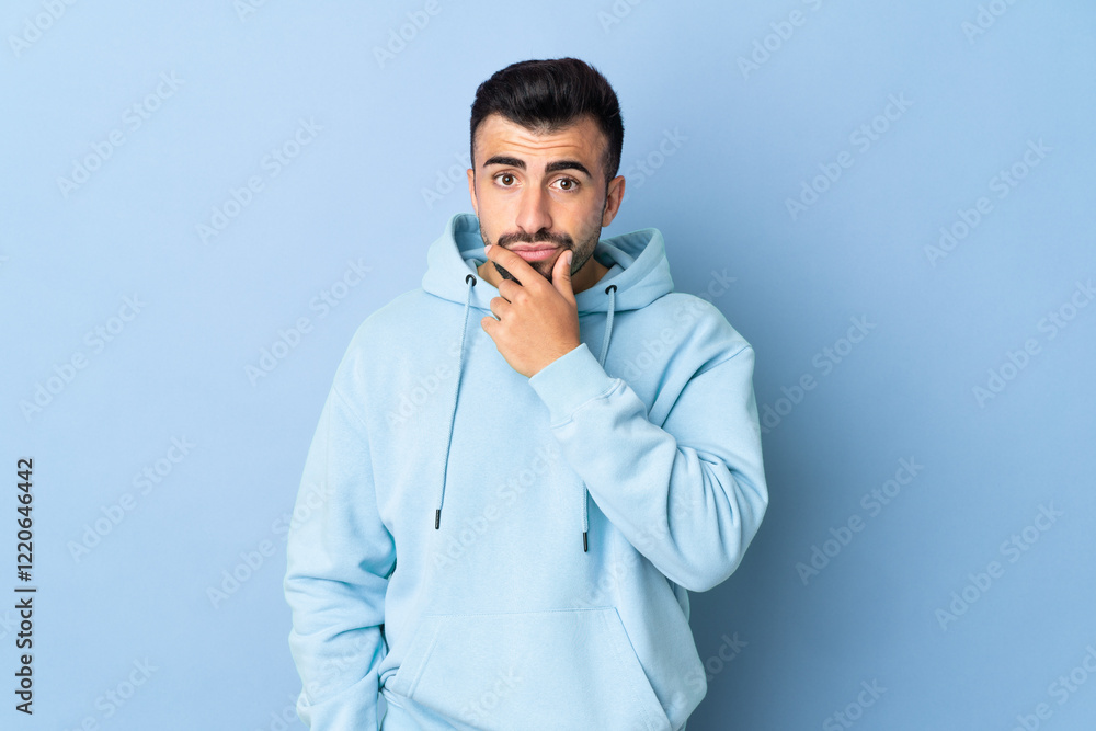 Caucasian man over isolated blue background thinking Caucasian man over isolated blue background thinking