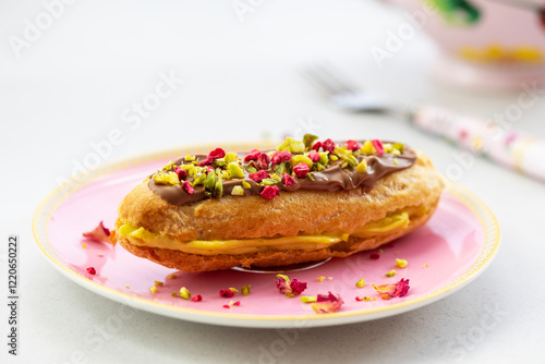 Elegant pistachio and raspberry eclair photo