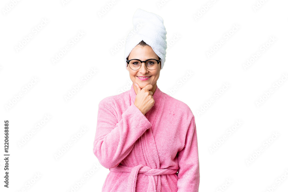 Middle age caucasian woman in a bathrobe over isolated background with glasses and smiling Middle age caucasian woman in a bathrobe over isolated background with glasses and smiling