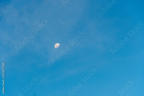 the moon is late in the blue sky