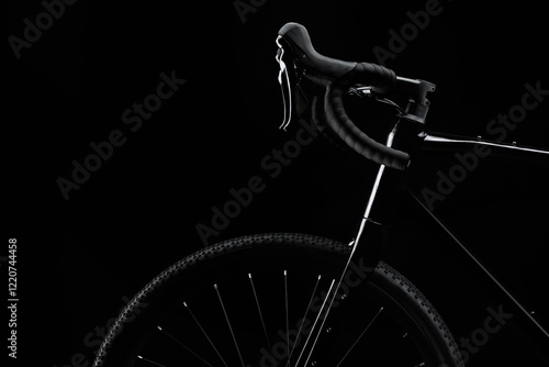 Silhouette of black gravel bike with luminous on black background