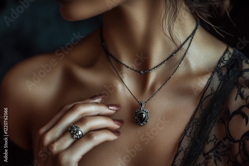 A closeup of a woman wearing a beautiful necklace and elegant ring