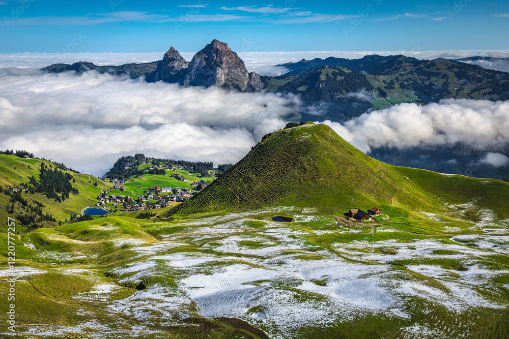 Snowy fields above the misty valley, Stoos village, Switzerland