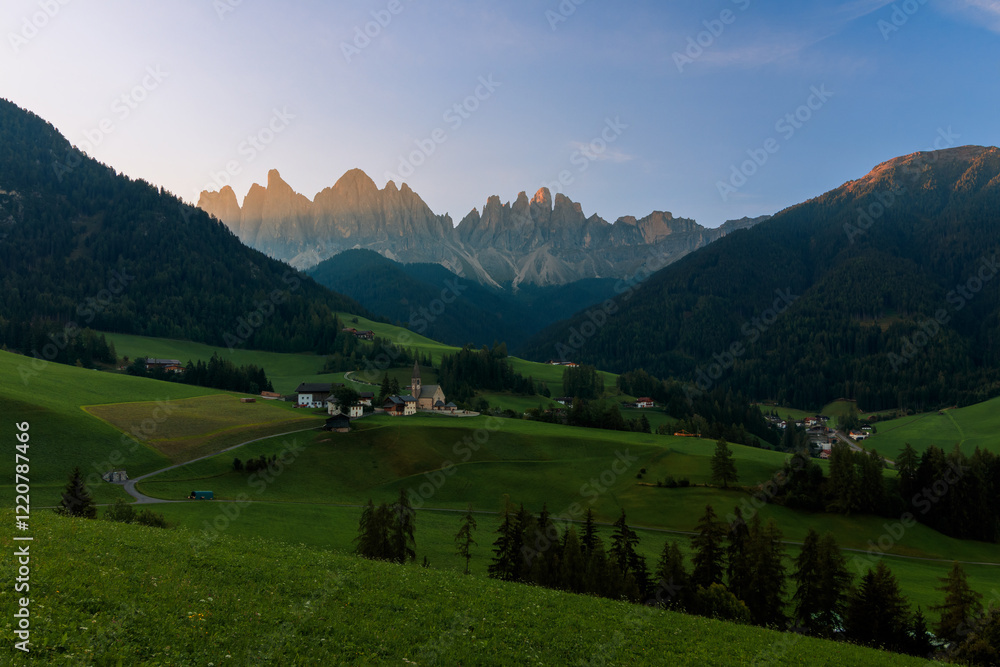 View above the Villnößtal Val di Funes with view on the Geislerspitzen Odlegruppa during sunrise warm light golden hour View above the Villnößtal Val di Funes with view on the Geislerspitzen Odlegruppa during sunrise warm light golden hour