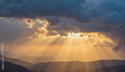 Sunlight breaking through storm clouds over mountains, hope and renewal photo