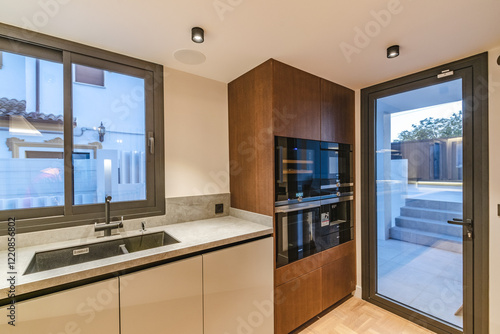 an image of a newly refurbished kitchen with various domestic appliances in luxury mediterranean villa real estate