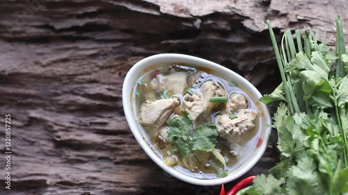 Spicy Chicken Soup in a bowl on wooden