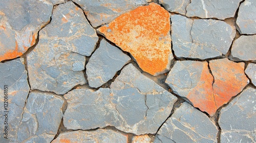 Irregular gray and orange stone pavement texture; perfect for design projects needing a rugged, natural look. photo