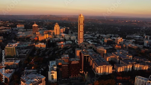 Aerial view at sunset time, showing the sunlit city of Sandton with vibrant sky in South Africa