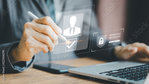 Businessman Digital Identity Verification, Hand holding stylus interacts with virtual security interface, Laptop background.