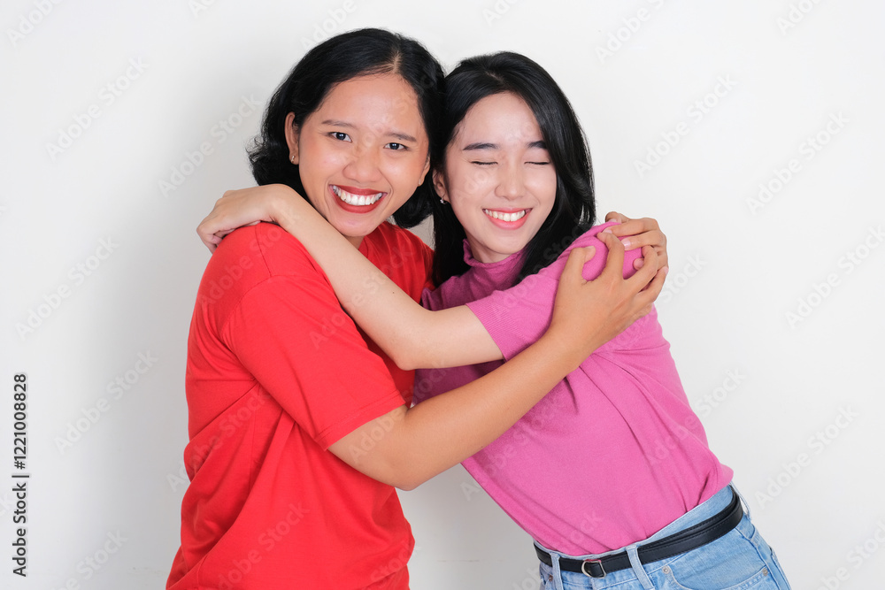 Two young girl hugging each other with happy face Two young girl hugging each other with happy face