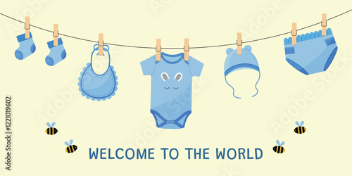 Baby shower welcome card with hanging baby boy clothes.