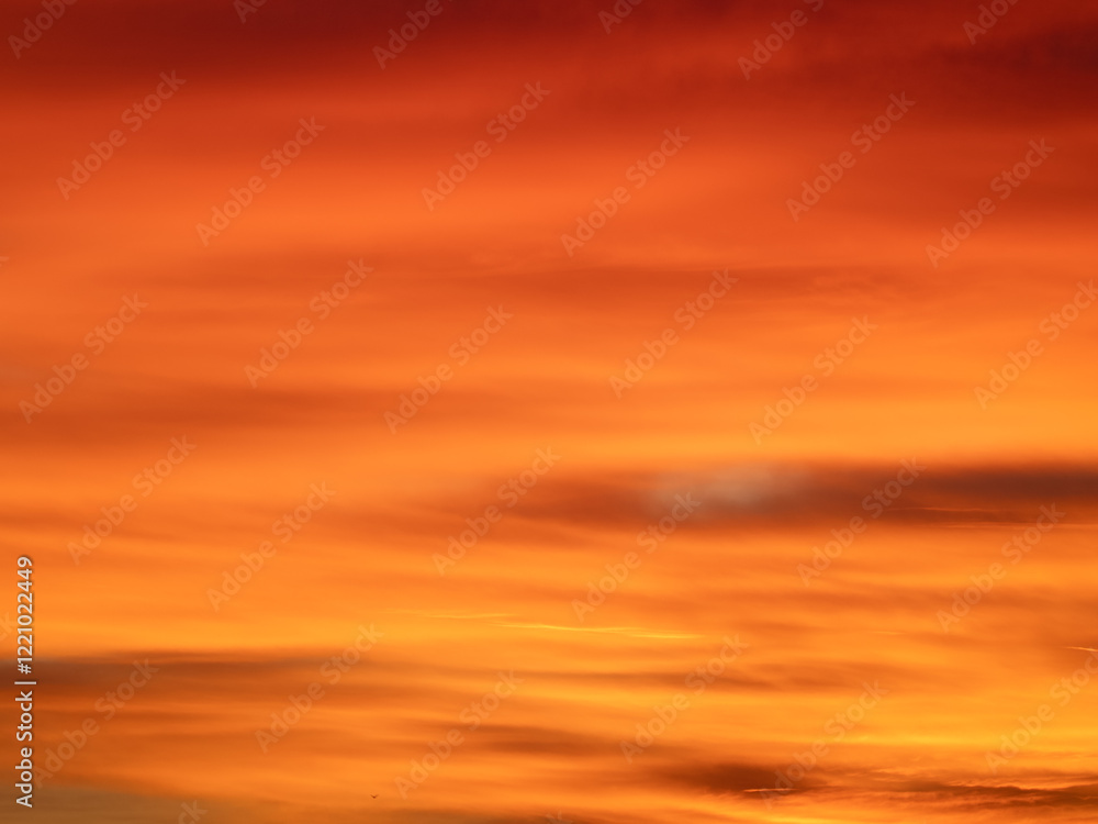 Fototapeta premium Dusk, Sunset Sky Clouds in the Evening with colorful Orange, Yellow, Pink and red sunlight and Dramatic storm clouds on Twilight sky, Landscape horizon