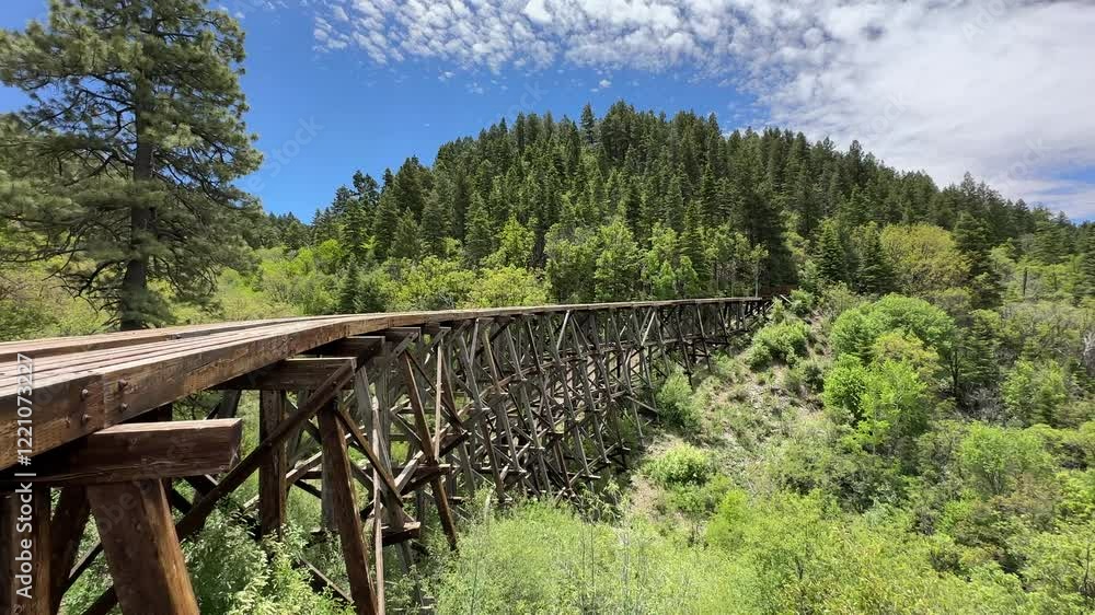 Historic wooden trestle bridge in Cloudcroft, New Mexico, historic mountain railway of the american wild west, rail tracks Historic wooden trestle bridge in Cloudcroft, New Mexico, historic mountain railway of the american wild west, rail tracks
